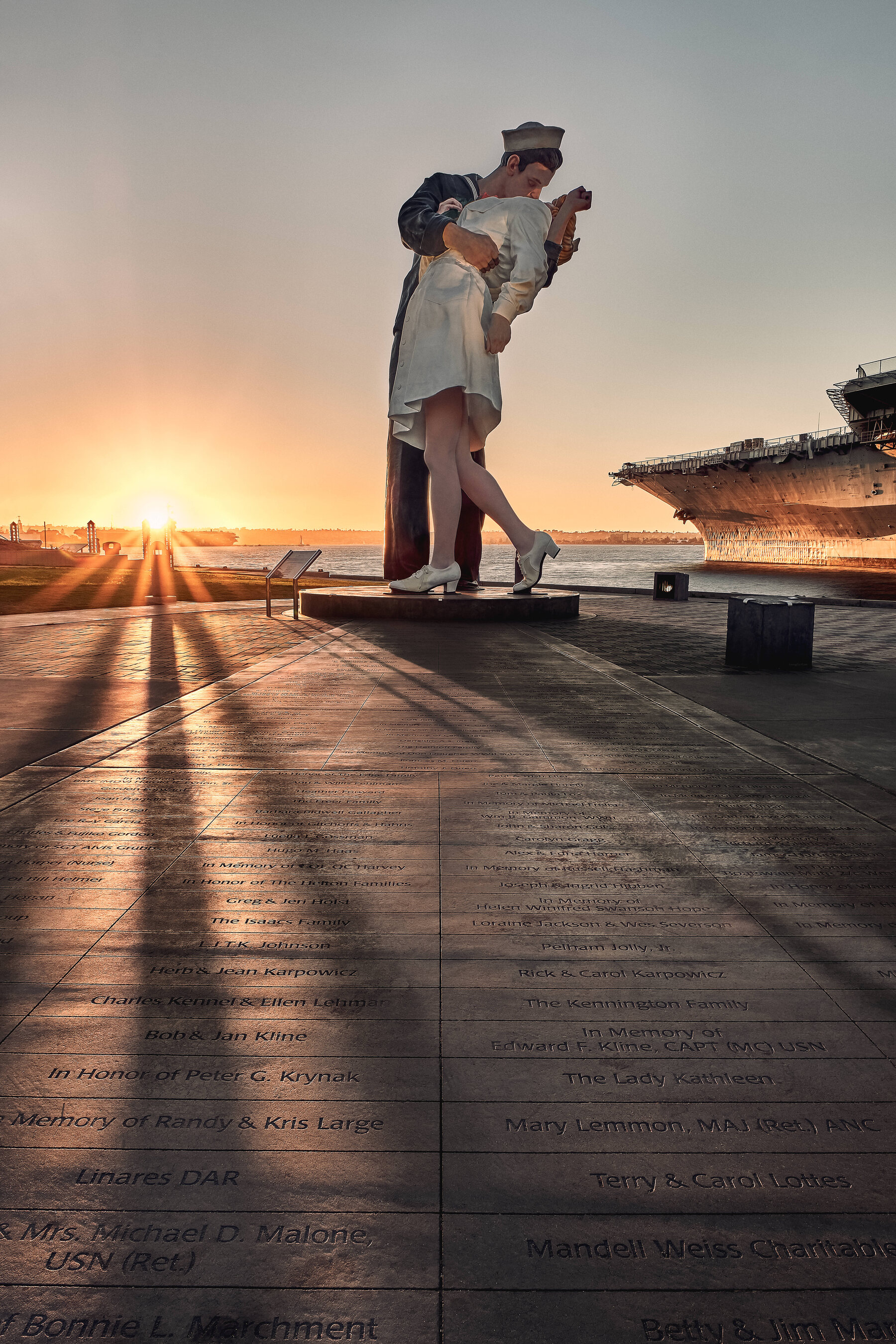 The Unconditional Surrender statue beside the USS Midway on the San Diego waterfront